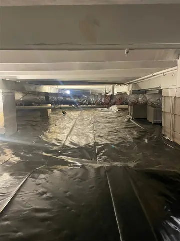 Crawlspace encapsulation with full black liner and duct insulation for improved air quality