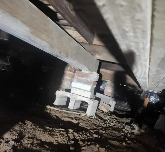 Crawl space foundation repair with concrete block support and beam stabilization in Benton KY home