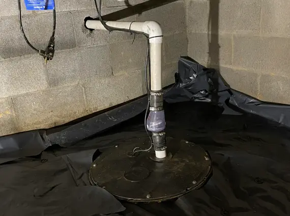Crawl space sump pump and vapor barrier system installed for waterproofing in Benton Kentucky